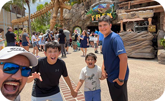 Dad and kids smiling