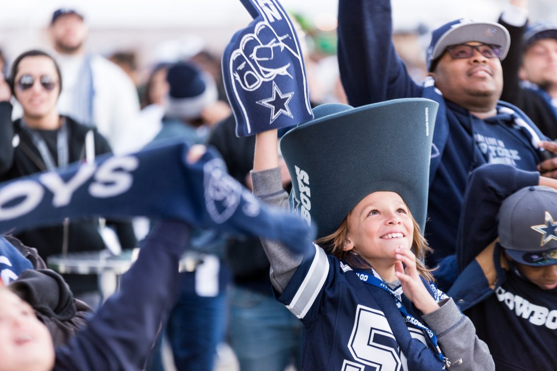 Arlington, Texas / USA - December 19, 2015: Young Dallas Cowboys Fan in a Big Cowboys Hat Outside AT&T Stadium in Arlington, TX